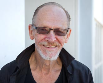 Man with sunglasses smiling at camera