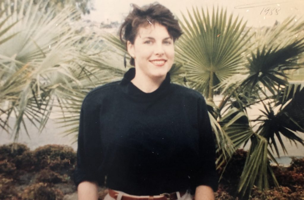 Jacinta in 1988 sitting in a garden